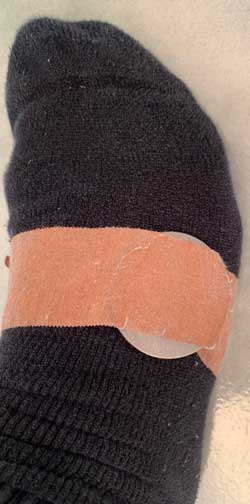 therapeutic Magnet application over sock in bed for soft tissue injury healing